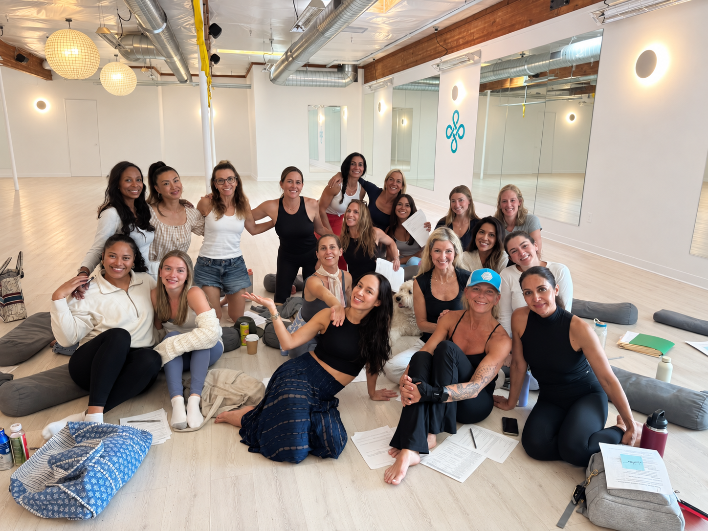 The NOW Power Yoga team together in the studio